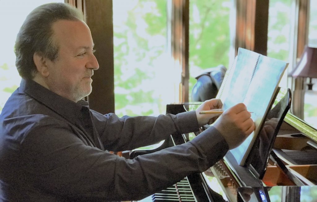 photo of lucas richman at a piano